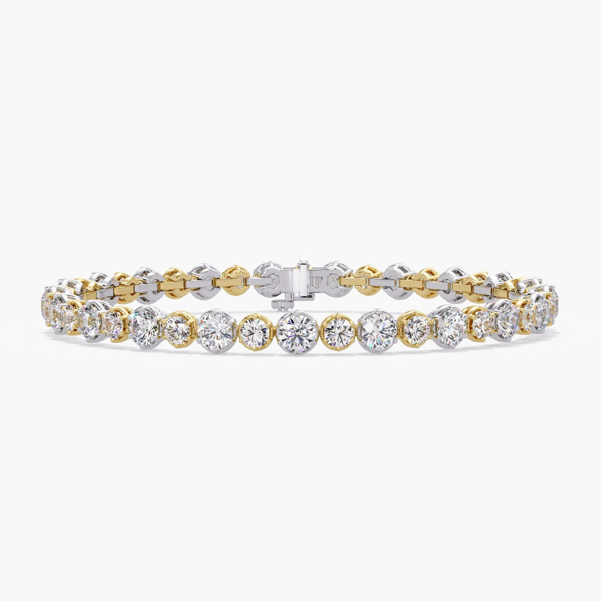 Alternating graduated lab diamond tennis bracelet showing 2.8mm and 3.5mm round diamonds in two tone 14K gold