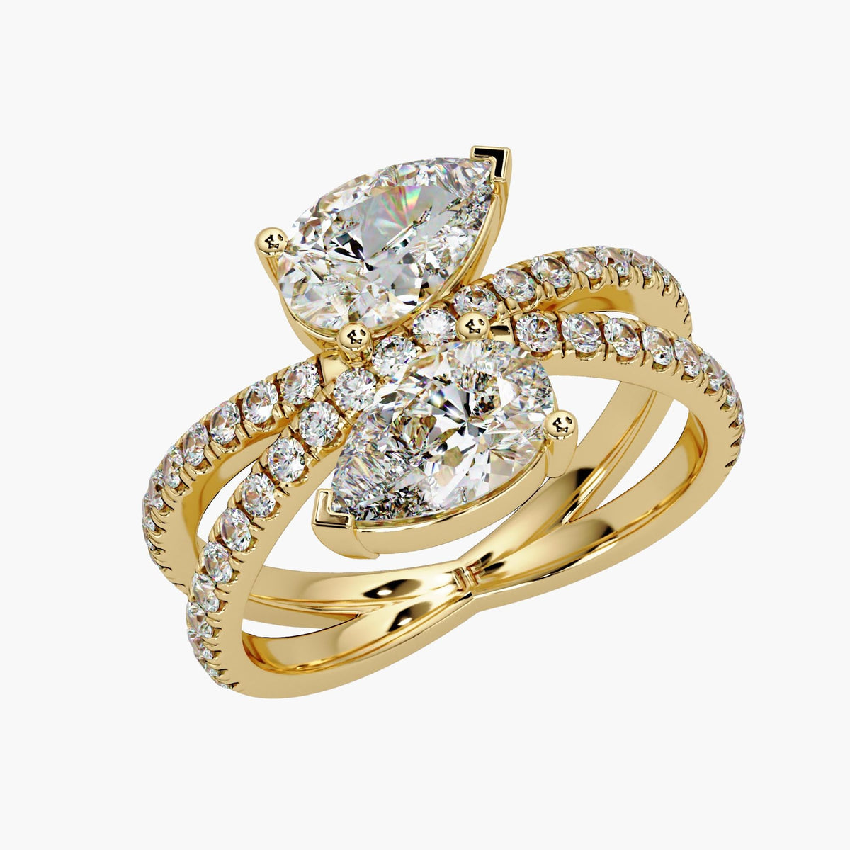14K yellow gold pear lab diamond bypass ring with double pavé crossover band, offset two stone design