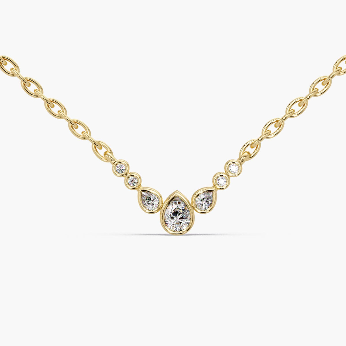 A dainty bubble diamond necklace crafted in solid 14K yellow gold. This pear cluster pendant features 0.20 CTW of lab diamonds on a 0.9 MM adjustable 16–18 inch chain. A minimal gold diamond necklace for everyday wear, layering, or a meaningful gift.