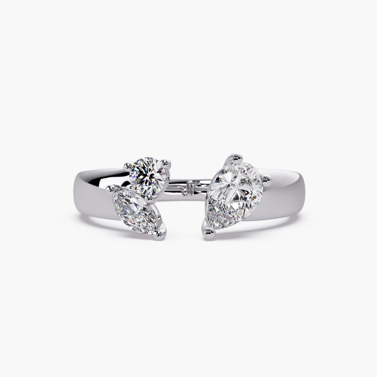 Multi shape lab grown diamond open ring in solid 14K gold featuring pear, round, and marquise stones in a sculptural wrap design.
Designed as a statement cigar band ring with a modern toi et moi feel, ideal for everyday styling or bold stacking.
A refined diamond ring for gifting, occasions, or a standout everyday piece.
