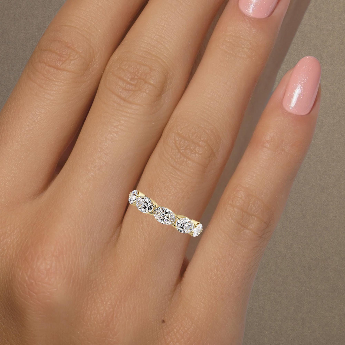 A showstopping east-west oval band, this 5-stone lab grown diamond ring features five 0.35 ct oval diamonds, creating an approximate 4mm diamond band across the finger.
This lab grown diamond anniversary band stacks effortlessly and makes a beautiful anniversary gift.