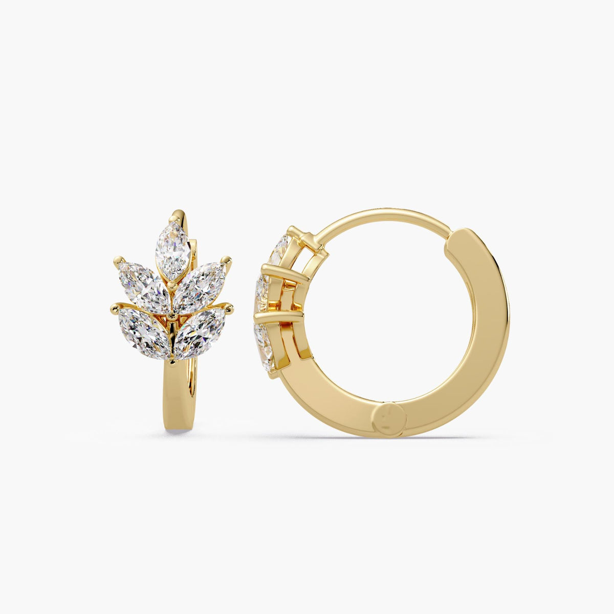 A pair of leaf huggie earrings crafted in solid 14K yellow gold, featuring marquise lab diamonds arranged in a leaf design cluster.