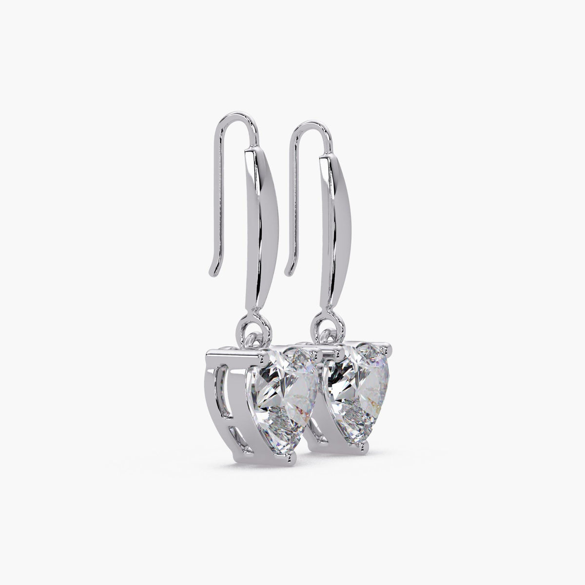 gold heart diamond dangle earrings side view prong set heart cut diamond
