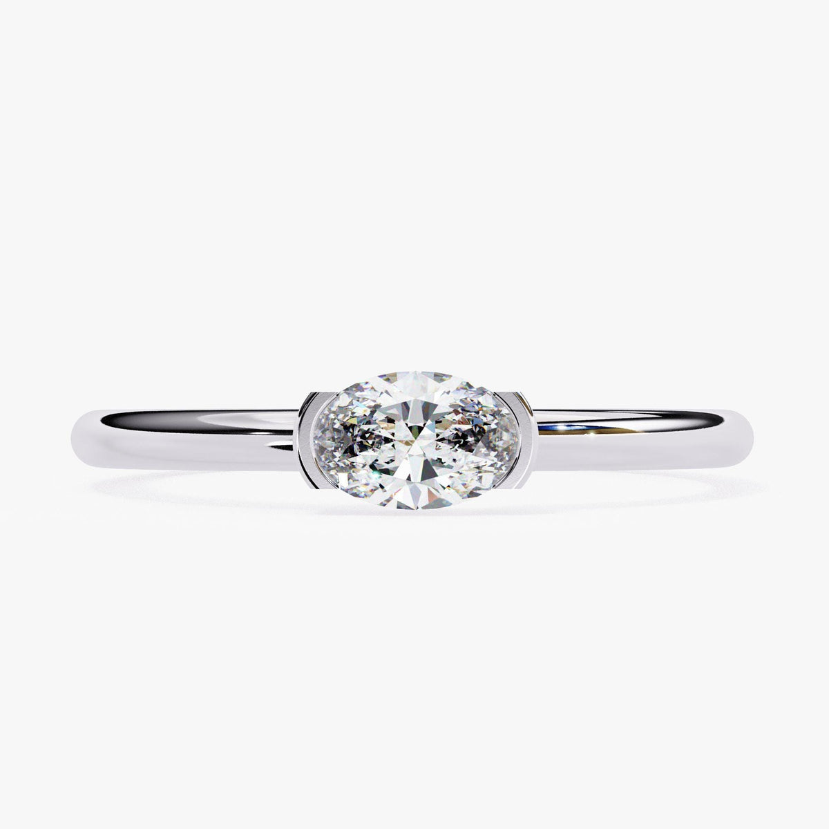 A close-up of a silver ring with a large, round diamond set in the center.