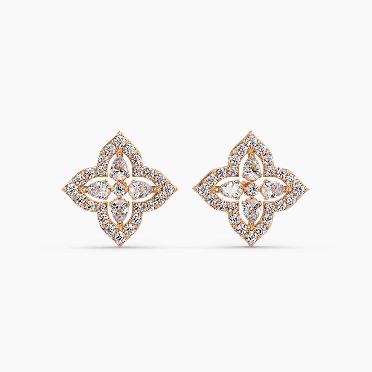 14K rose gold clover diamond stud earrings with pear and round stones, halo cluster design