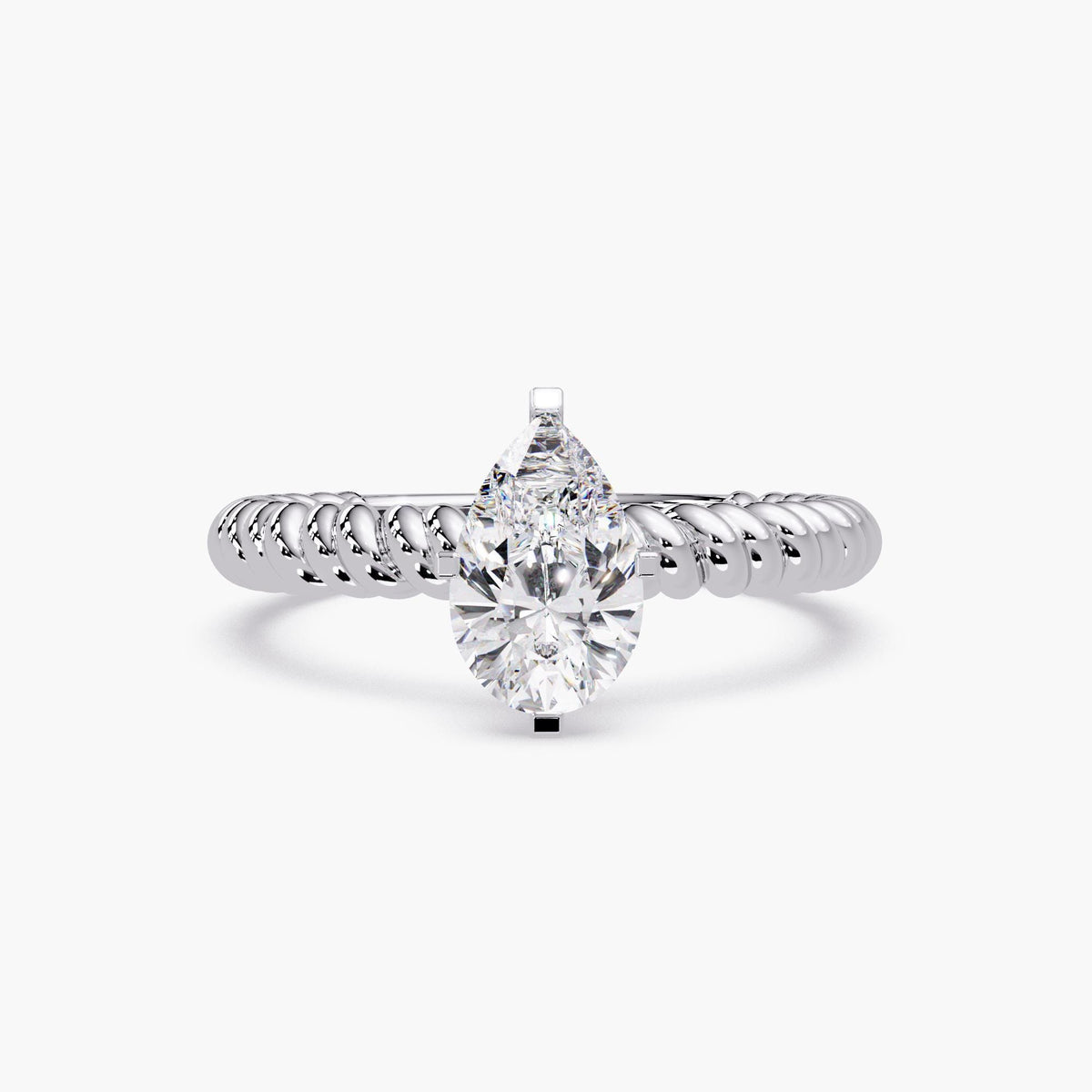 white gold ring featuring a large pear-shaped diamond solitaire on a thick rope band.