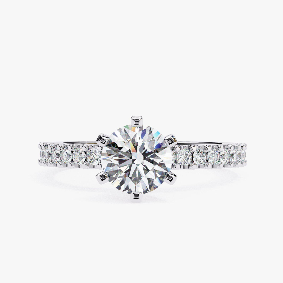 A close-up of a diamond engagement ring with a large central diamond surrounded by smaller diamonds set in a band.