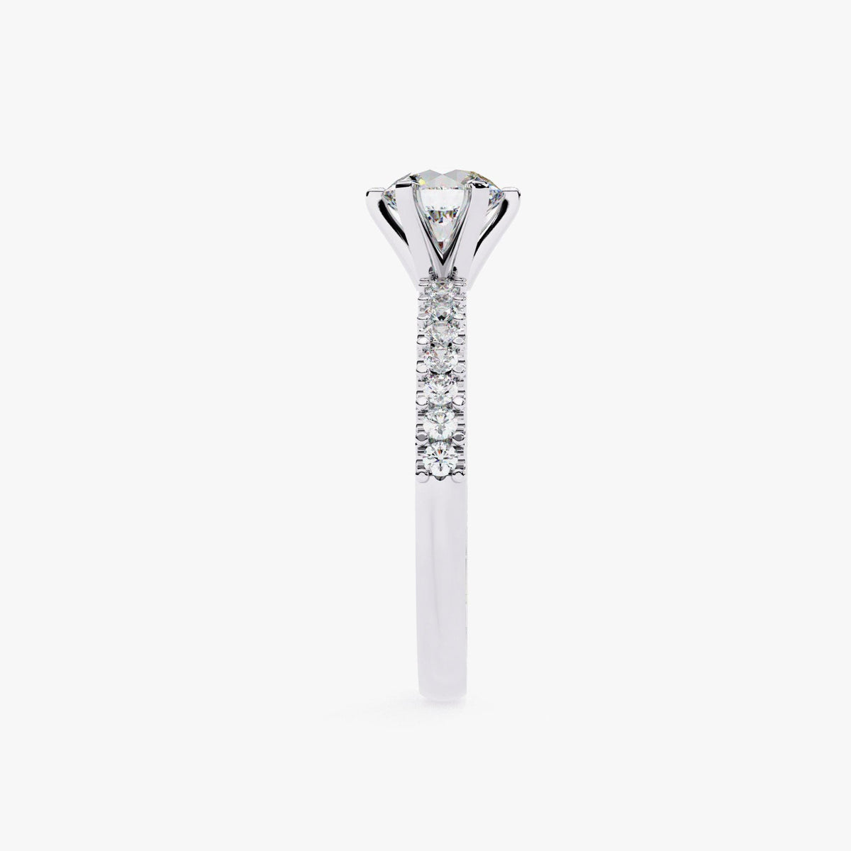 A close-up view of a diamond engagement ring with a large central diamond surrounded by smaller diamonds set in a silver band.