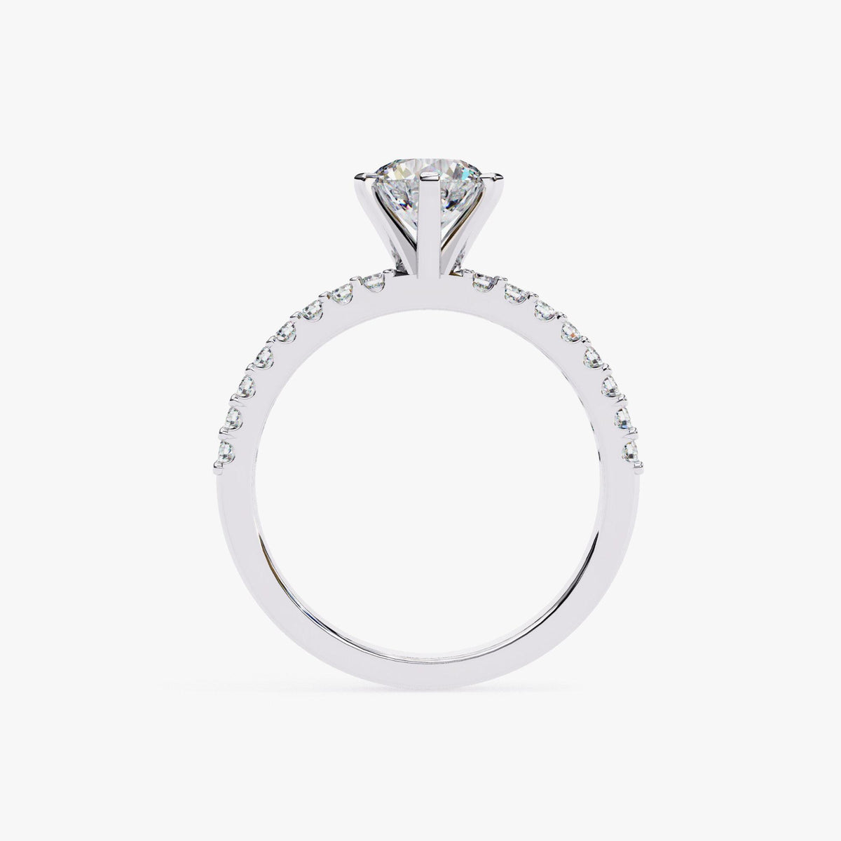 A close-up view of a silver engagement ring with a large diamond set in the center.