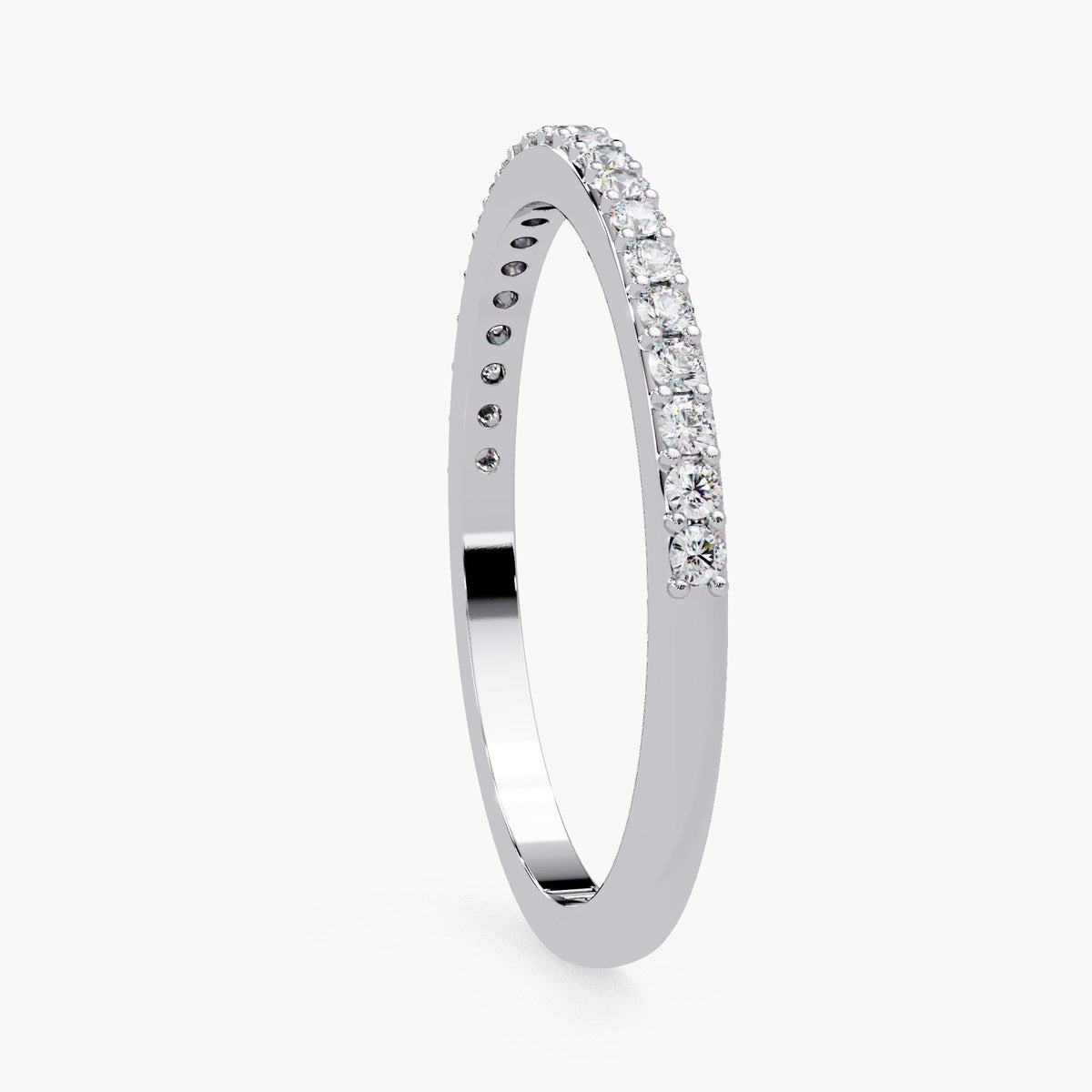 A silver ring with a row of diamonds along the band.