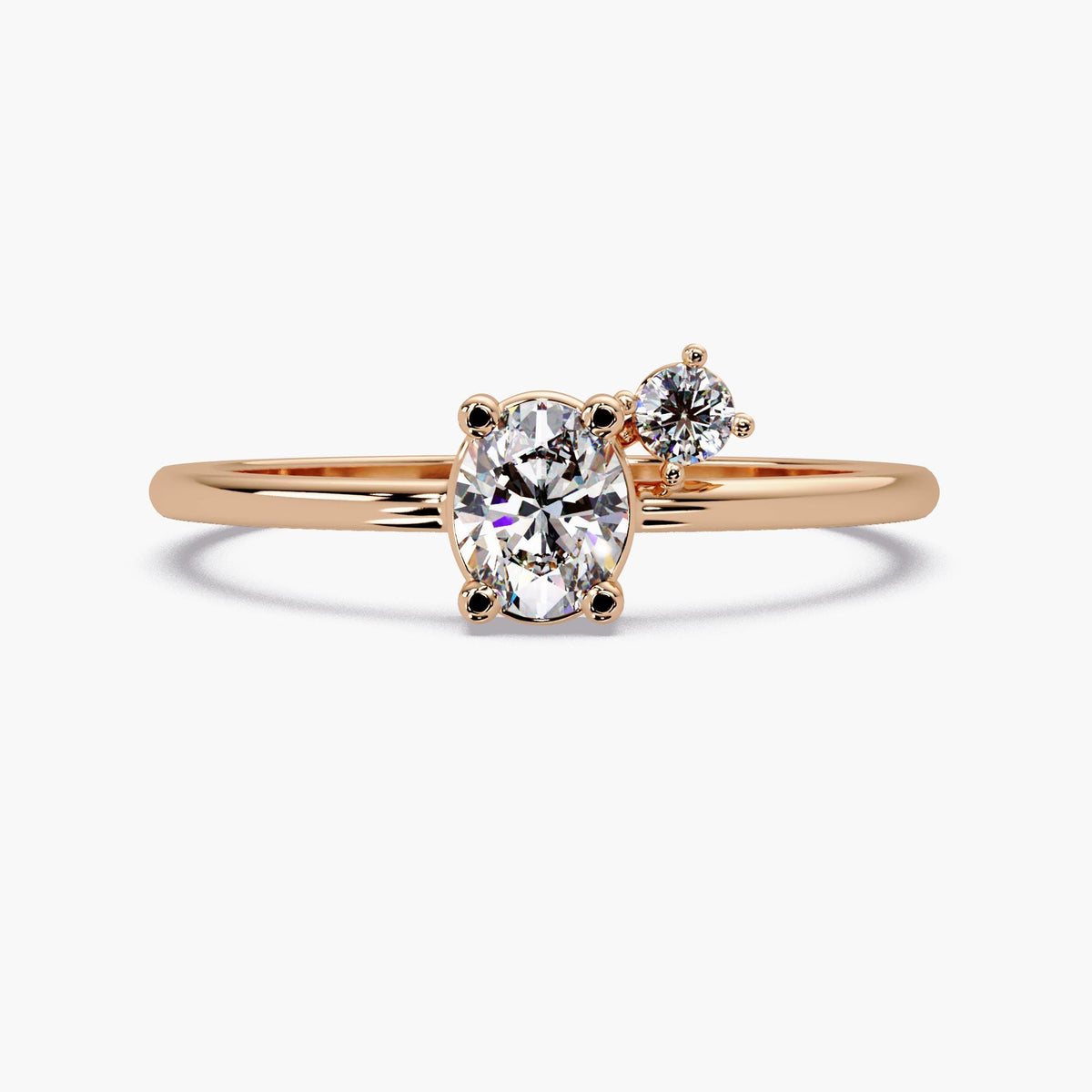 A gold ring with a large oval-shaped diamond in the center, surrounded by smaller diamonds.