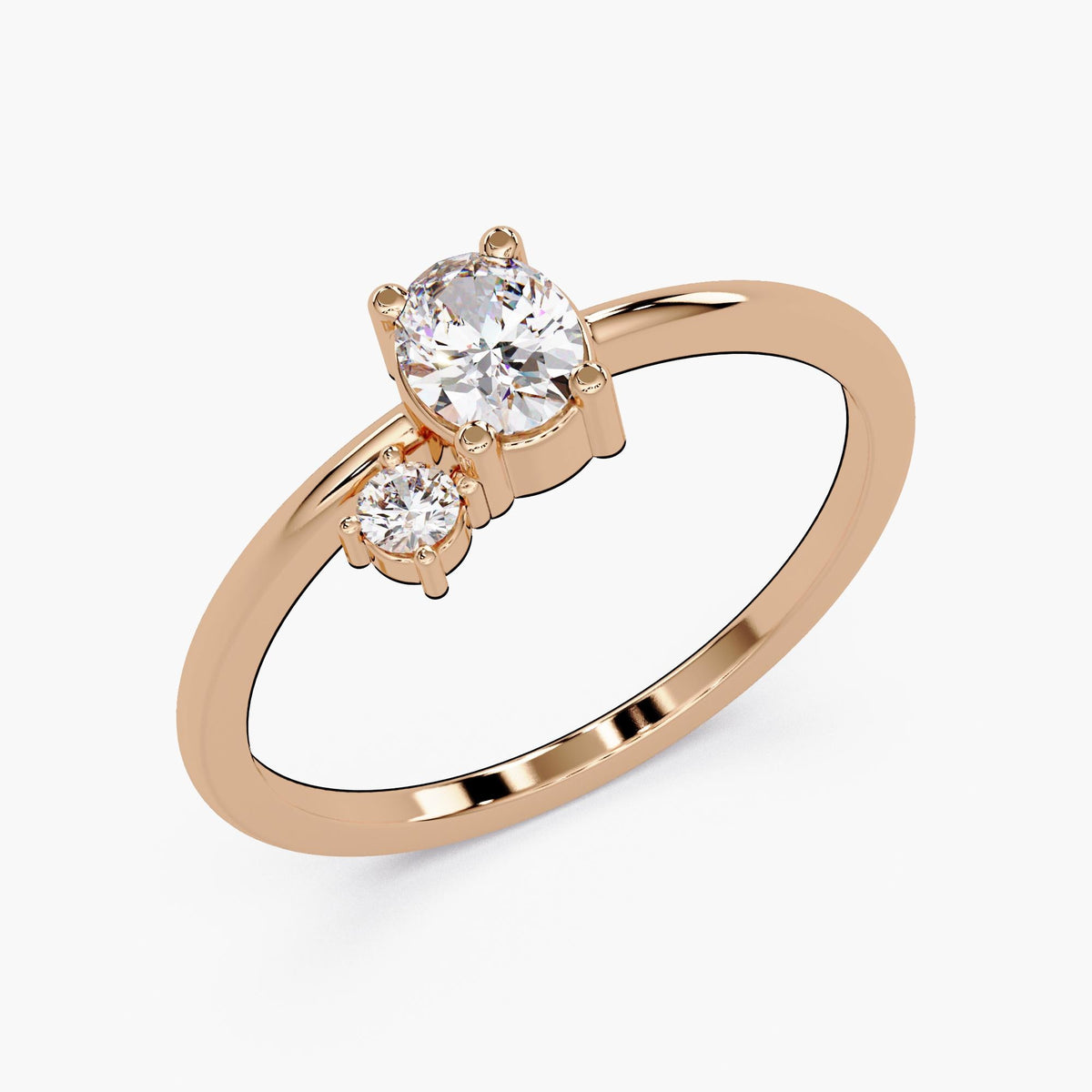 A gold ring with a large central diamond and two smaller diamonds on either side.