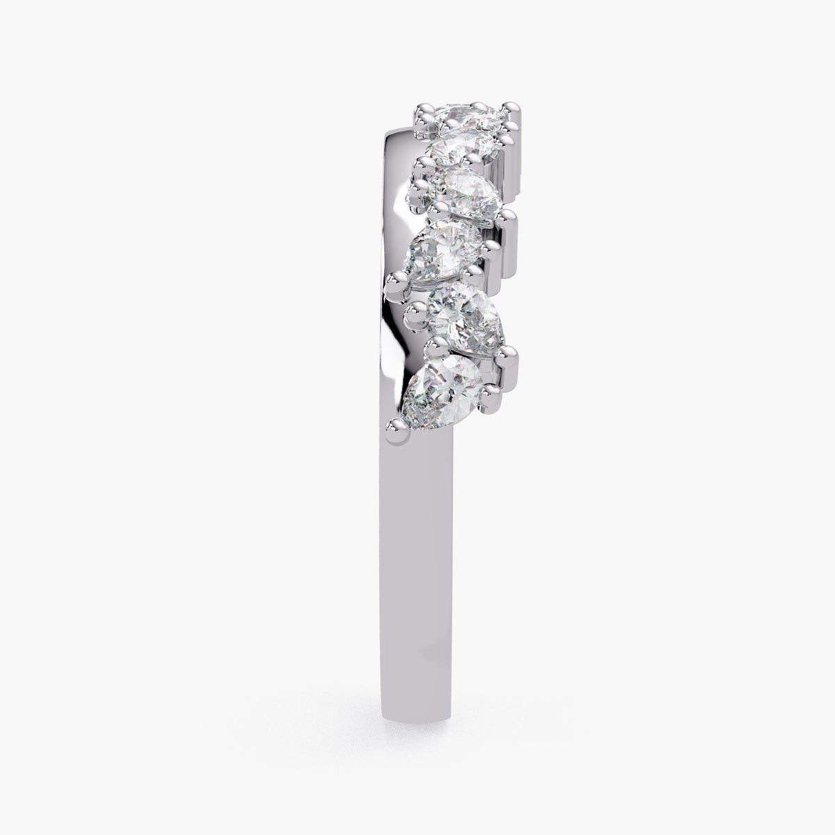 A silver ring with a row of diamonds set in it.