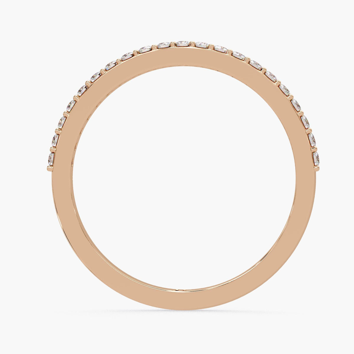 A gold ring with a row of small diamonds along the edge.