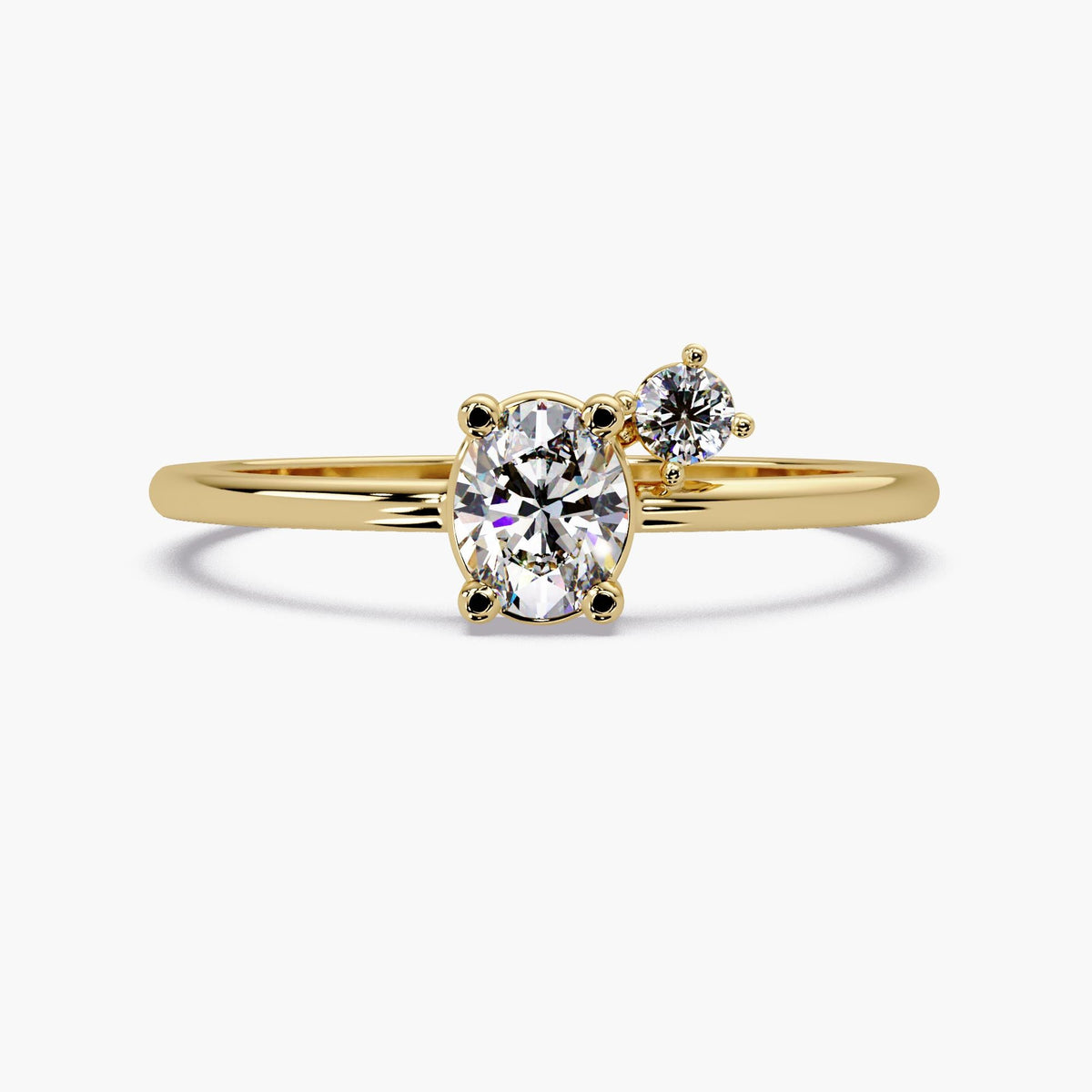 14K yellow gold oval lab grown diamond engagement ring with round accent diamond.