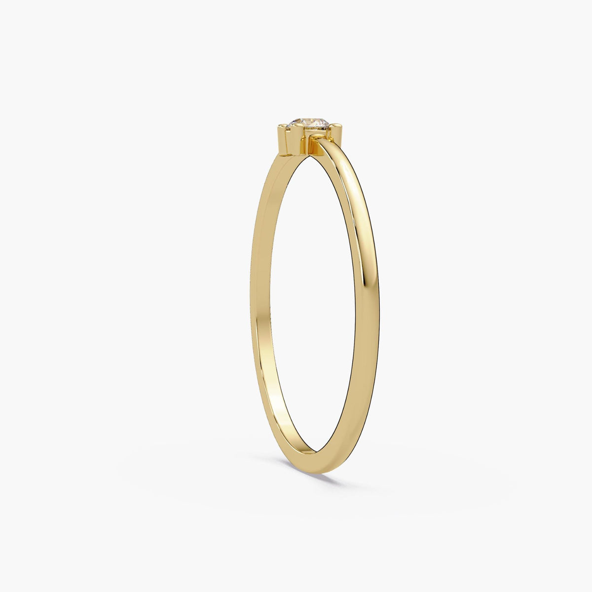 0.15 CT round natural diamond engagement ring worn on hand with delicate 14K gold band