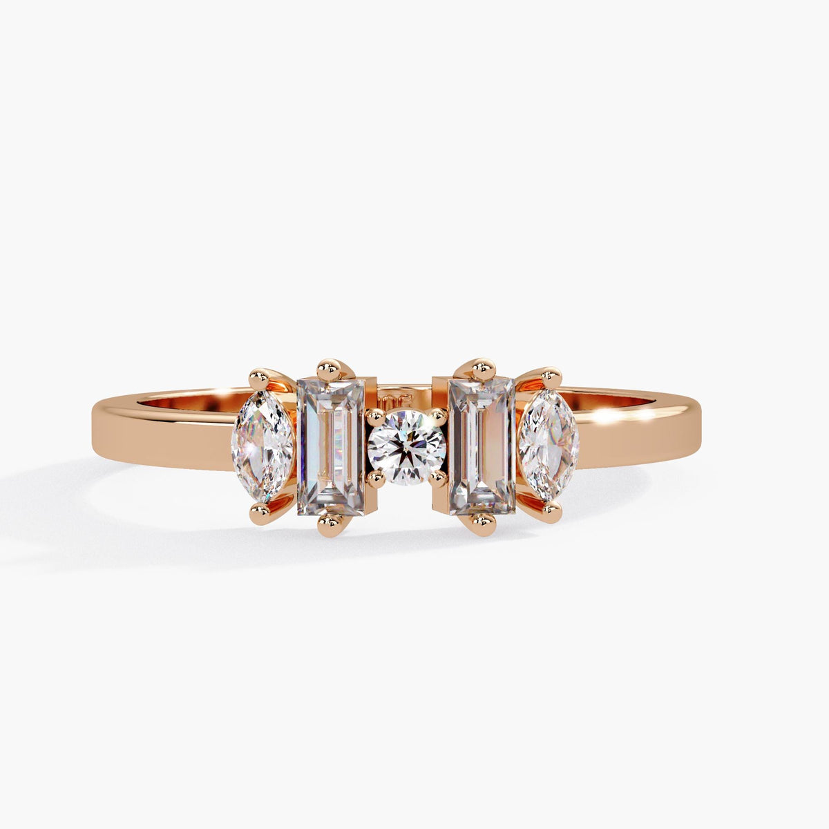 Luxury 14K gold statement ring with emerald, round, and pear diamonds.