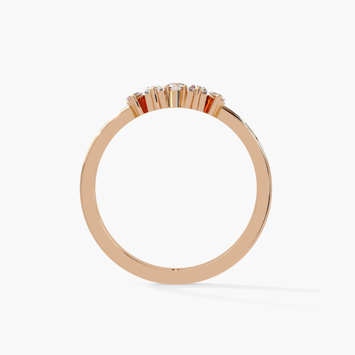 A gold ring with a row of small diamonds set in the center.