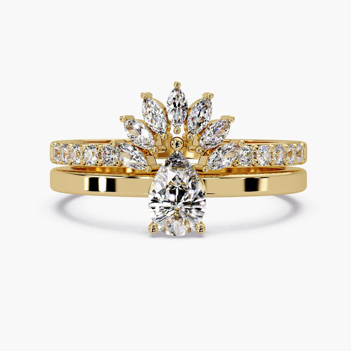 The pear lab-grown diamond solitaire placed below a coordinating marquise crown band and pavé band; the additional bands are not included.
