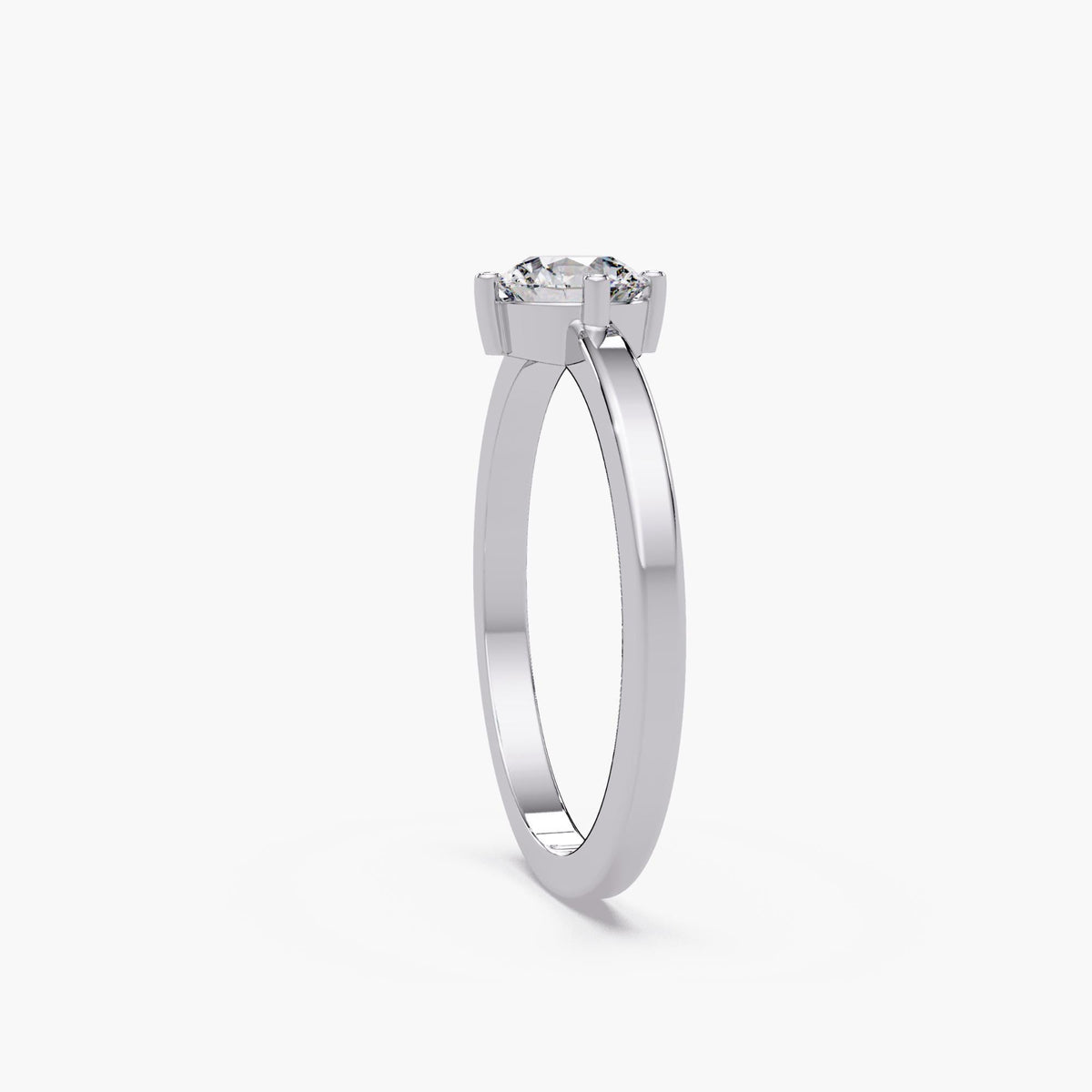 Four-prong compass-setting profile / white-gold solitaire side view / slim-band diamond engagement ring / round lab-diamond ring setting