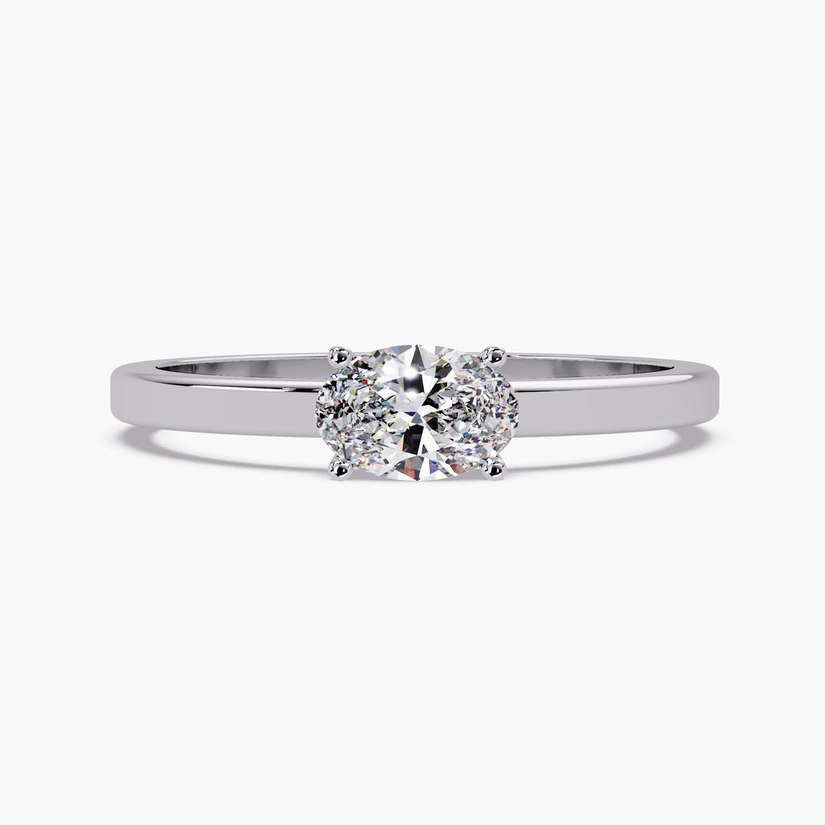 The oval lab-grown diamond solitaire ring in 14K white gold with a slim polished band and four-prong setting.