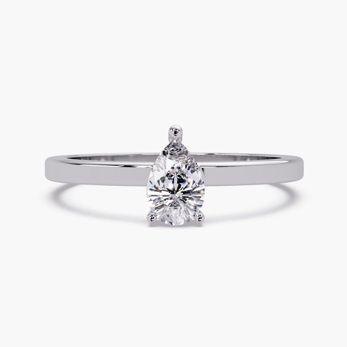 The pear lab-grown diamond solitaire ring in 14K white gold with a slim polished band and three-prong setting.