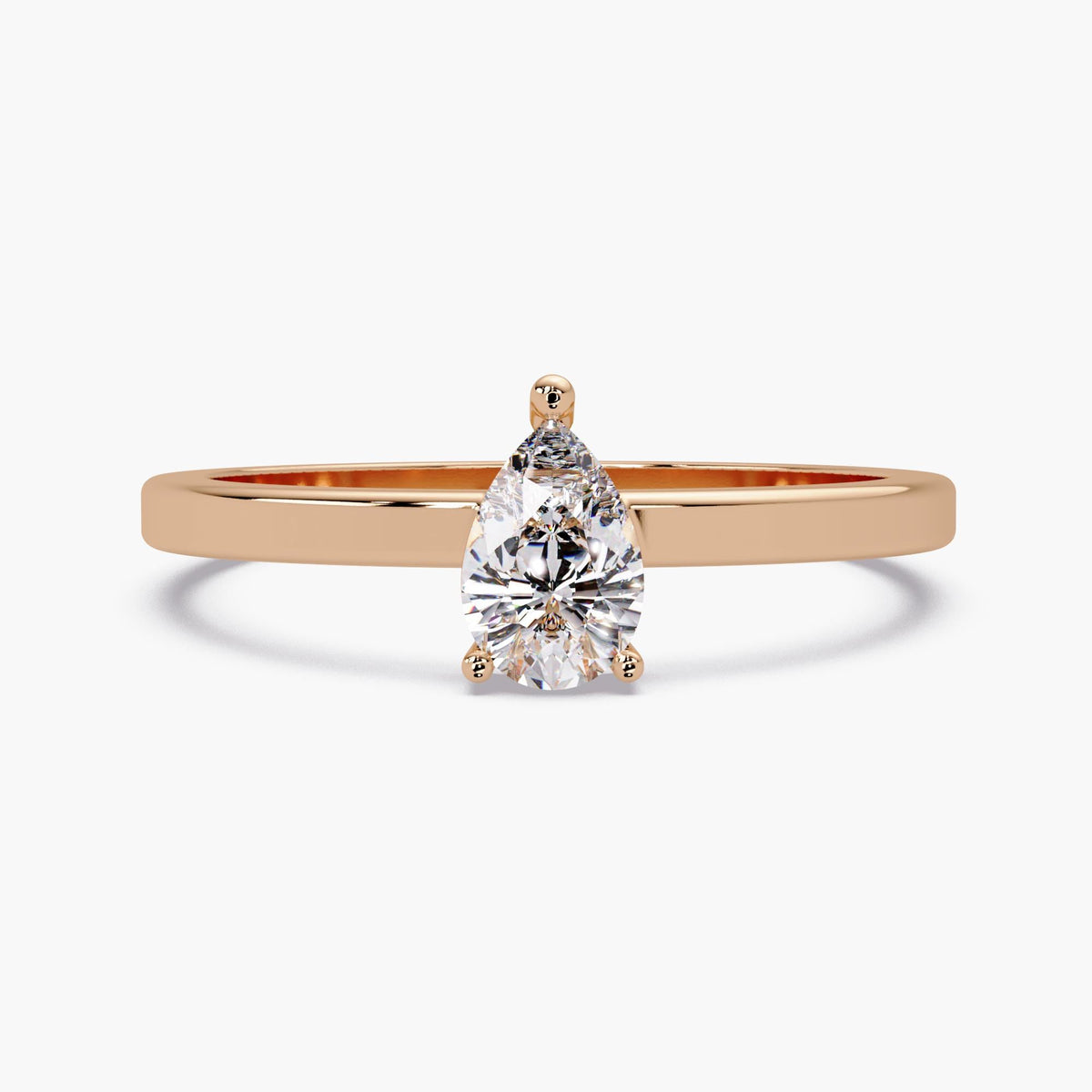 The pear lab-grown diamond solitaire ring in 14K rose gold with a slim polished band and three-prong setting