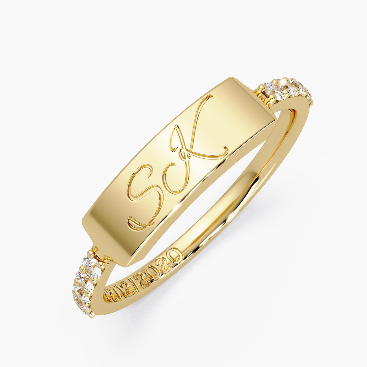 Custom two-letter ring in solid 14K yellow gold with script initials, diamond band accents, and an engraved date inside.