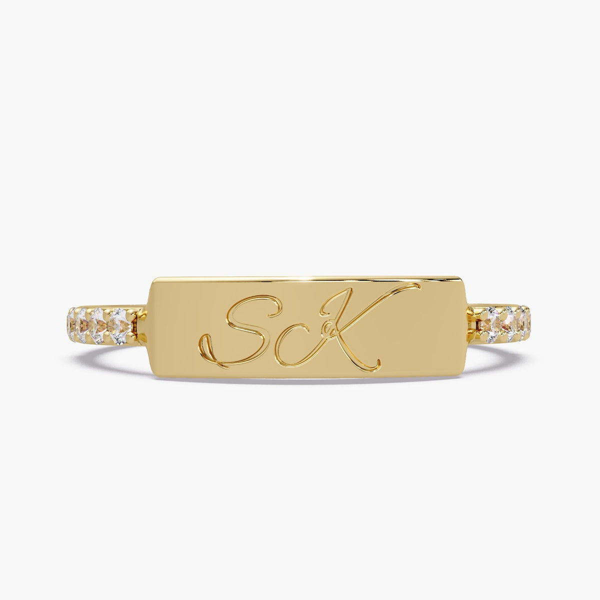 Personalized 14K yellow gold double initial ring with script S and K engraving and lab-grown diamond accents.