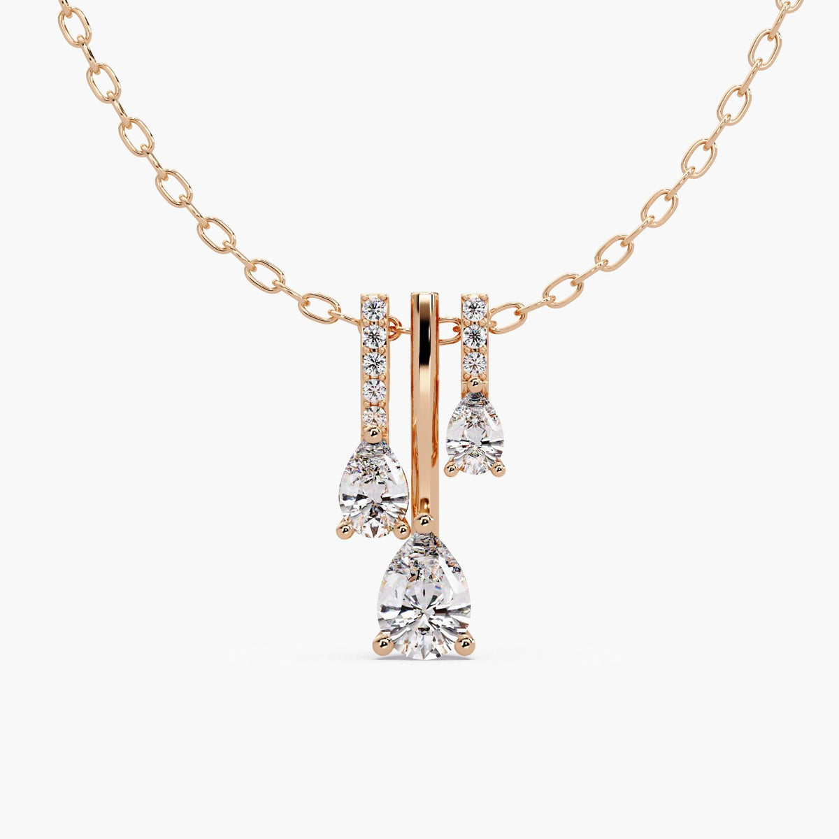 14K rose gold triple pear lab-grown diamond drop necklace with three graduated pear diamonds and round pavé accents.