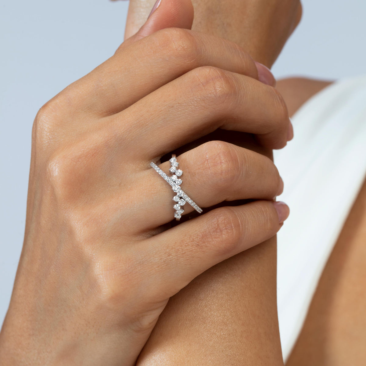 14K gold diamond X crisscross ring with 0.45 CTW round lab-grown diamonds in prong and pavé settings, worn on the finger.