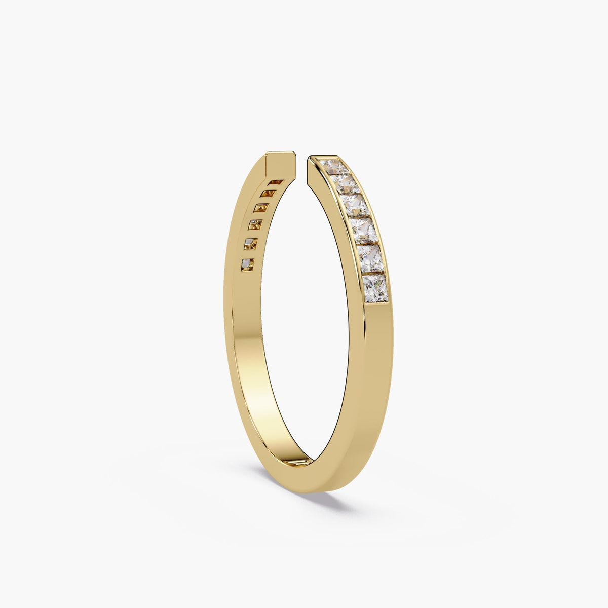 Slim polished profile of the yellow gold open-gap ring.