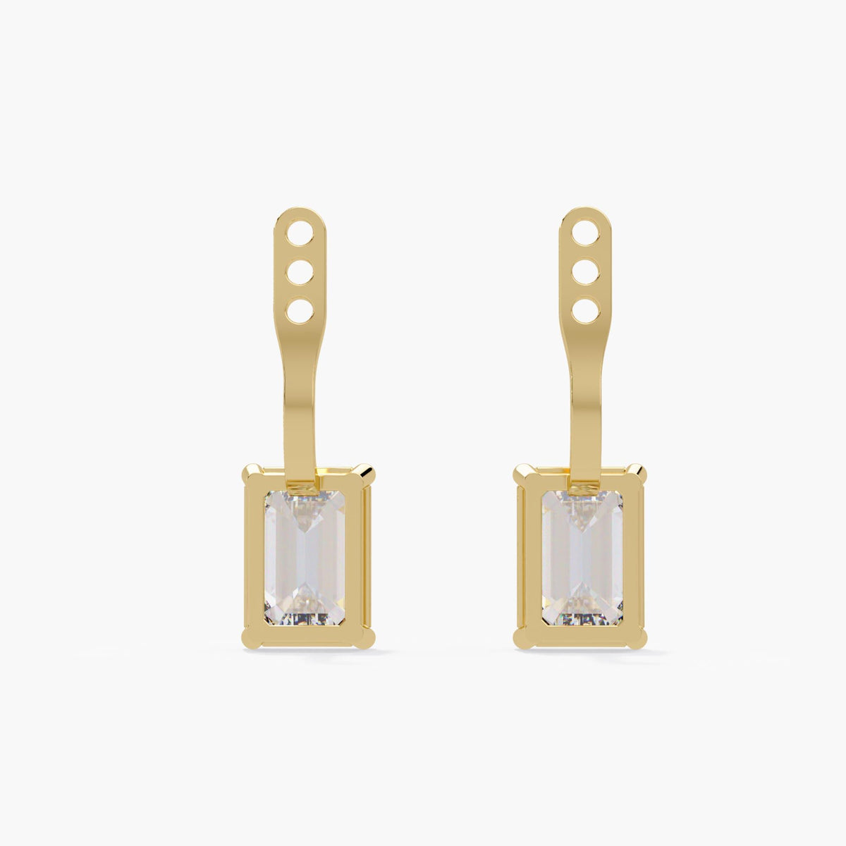 Yellow gold emerald-cut diamond earring jackets showing the open settings and three adjustment holes.