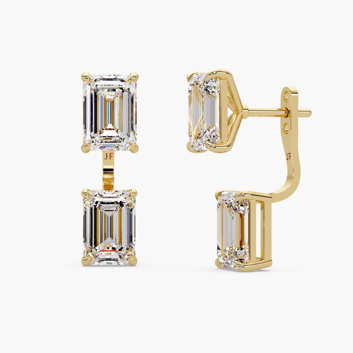 Yellow gold emerald-cut diamond earring jackets beside a vertical measurement guide.