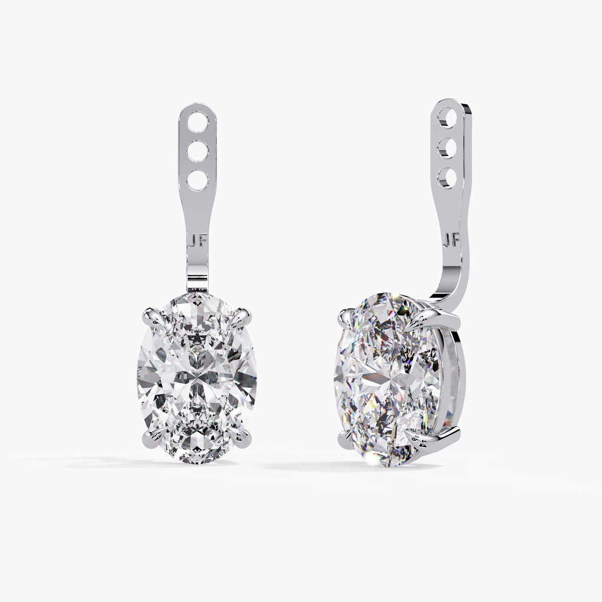 Adjustable diamond earring jackets for studs in 14K white gold with oval lab-grown diamond drops, claw settings and three placement holes.