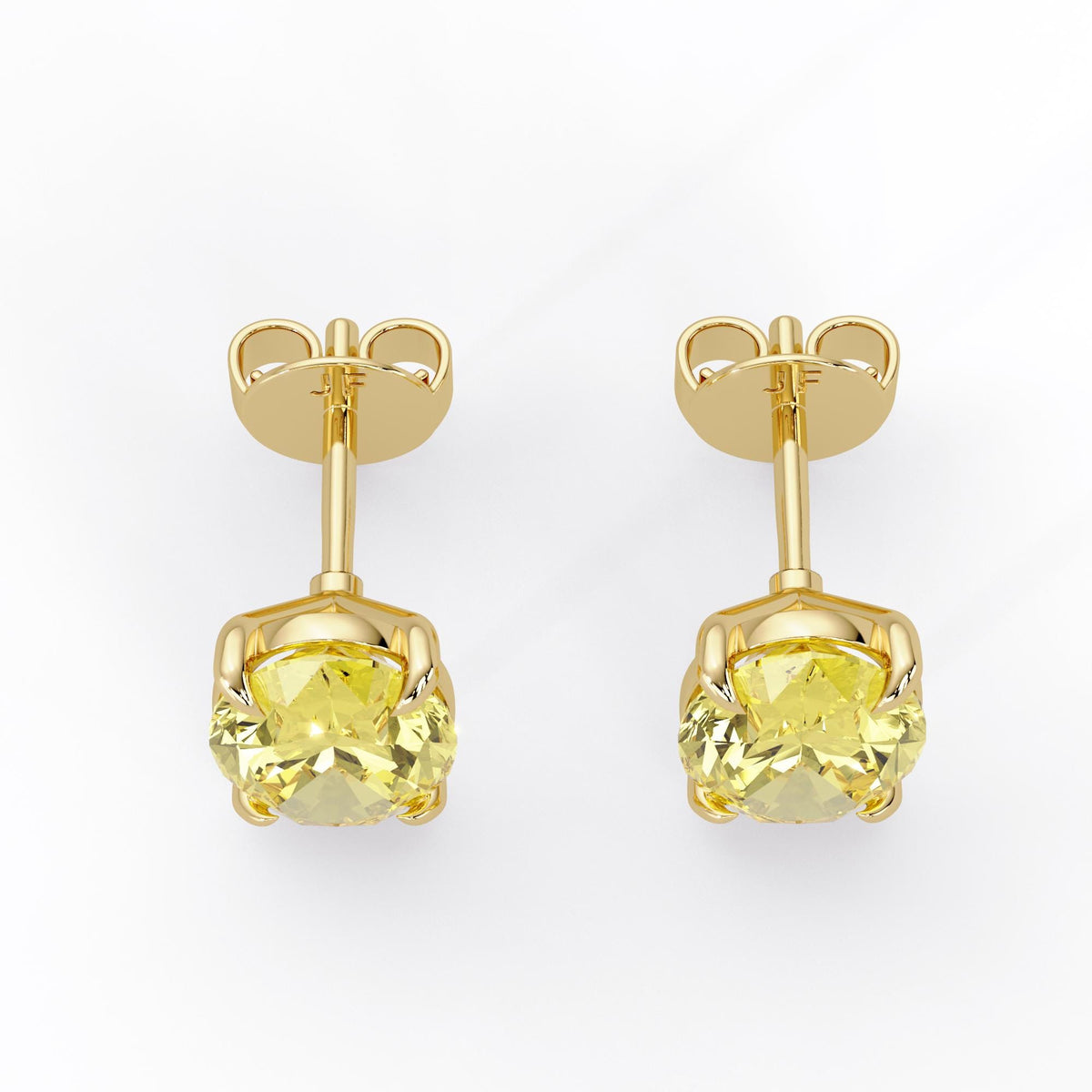 Oval fancy intense yellow lab grown diamond stud earrings in 14K yellow gold with claw settings, straight posts and butterfly pushbacks.