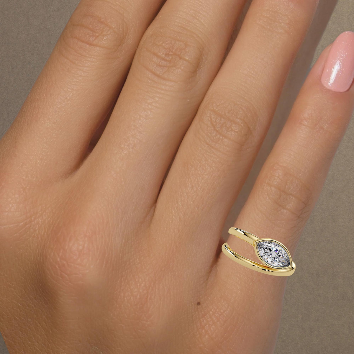 Marquise diamond bypass ring worn on hand / 14K yellow gold statement or pinky ring / east-west bezel setting