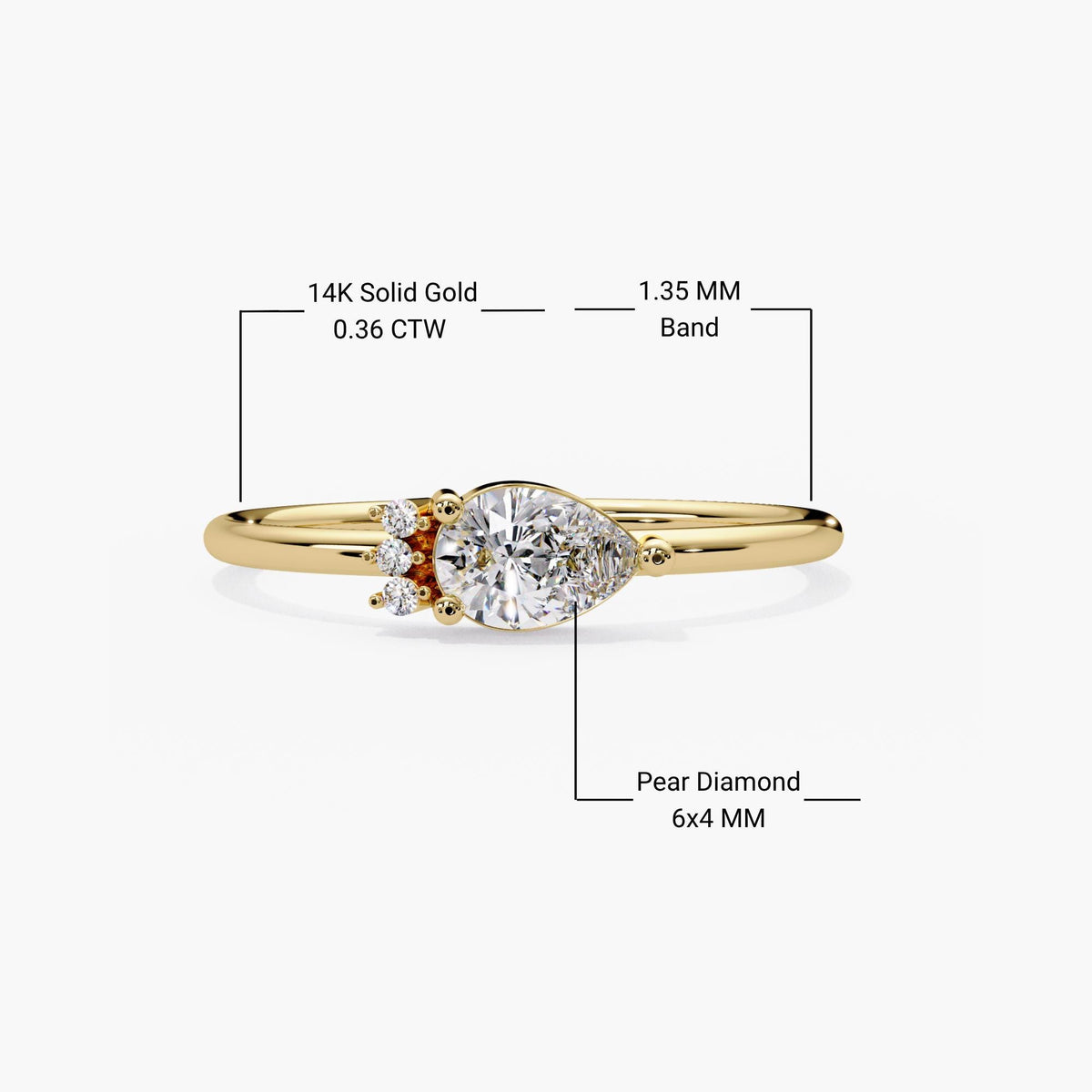 14k solid gold east west pear ring with a 6x4mm pear diamond and 1.1mm round accents on a 1.35mm band.