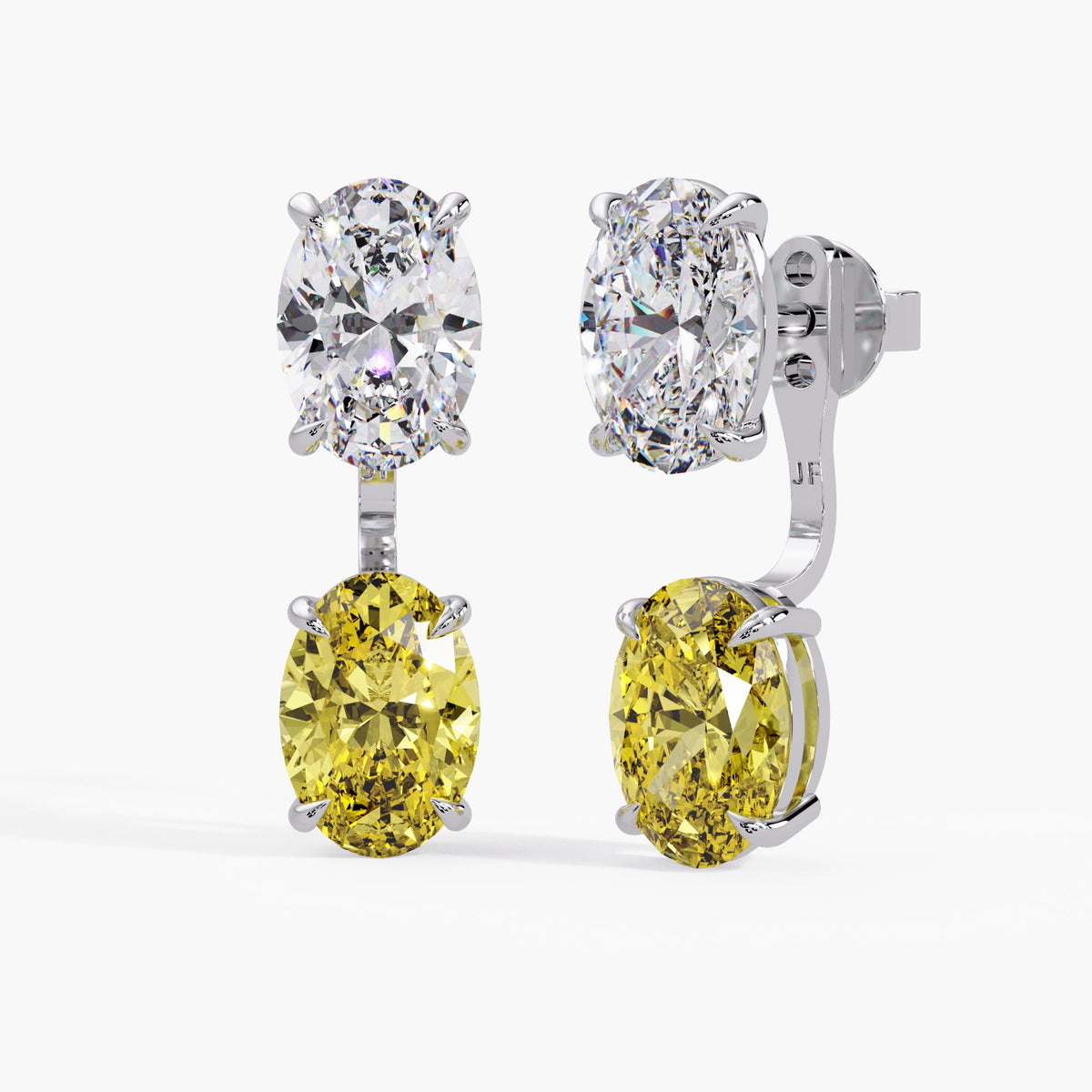 White gold yellow diamond jackets paired with white oval diamond studs / two-stone combination