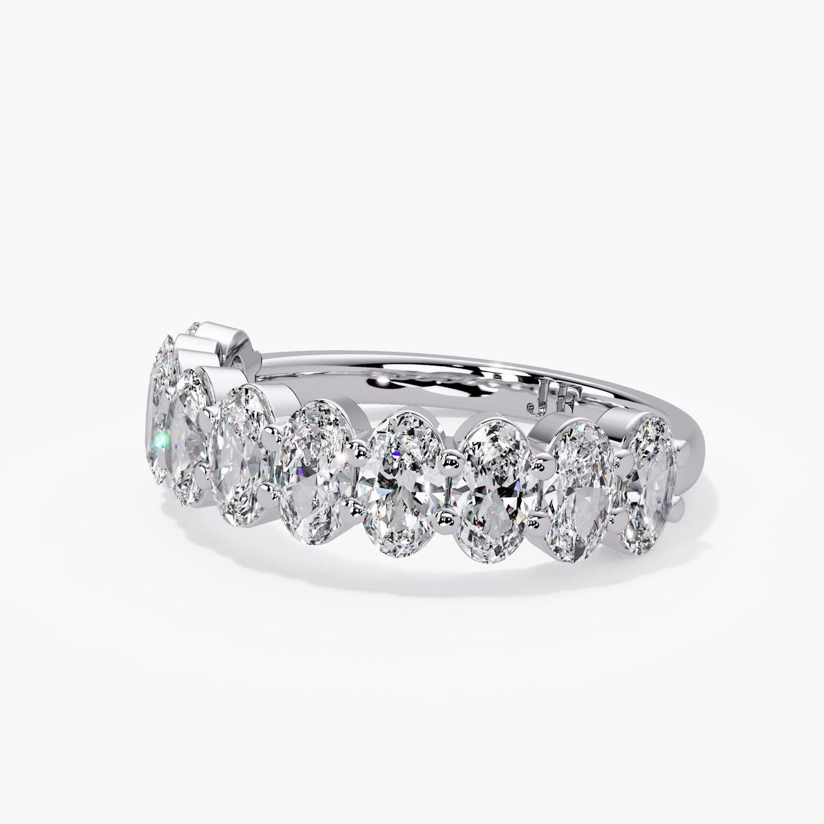 Oval lab diamond stacking ring in 14K white gold, with shared prongs and a half eternity arrangement.