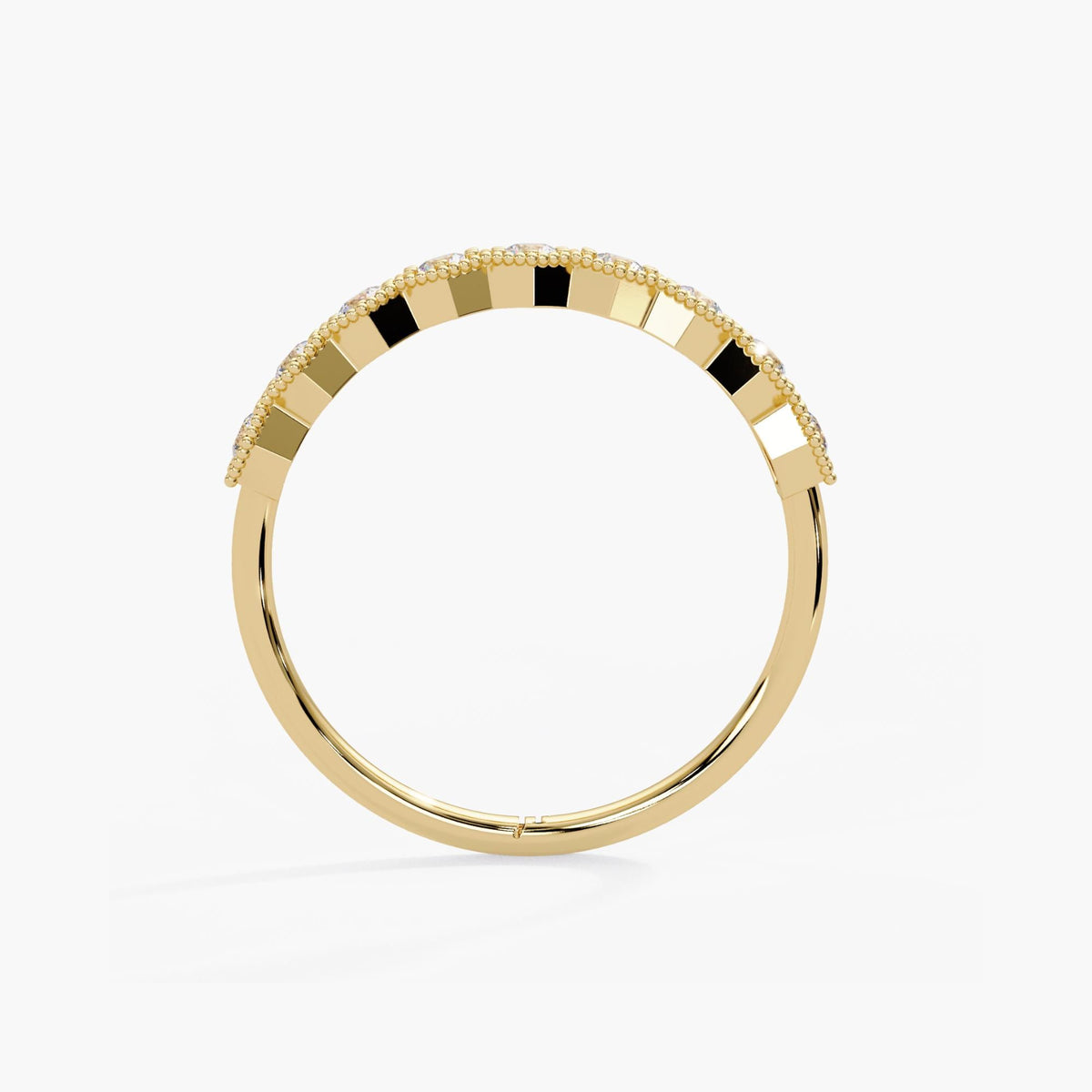 14K yellow gold diamond anniversary band with open settings beneath the diamonds and a smooth, polished lower shank.