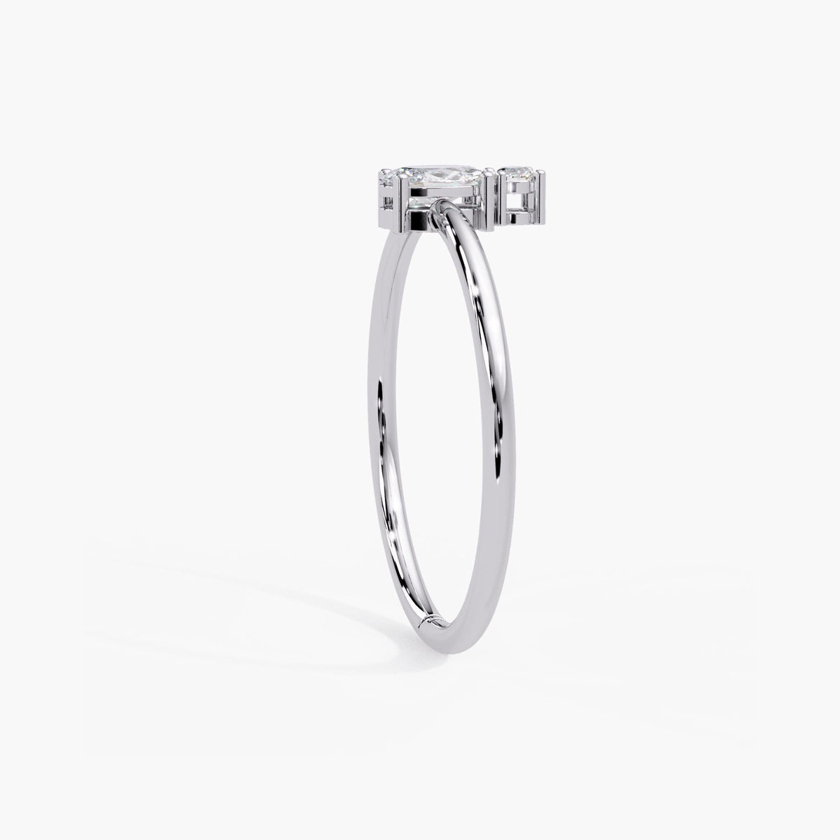 Dainty 14k white gold oval diamond stacking ring with a slim band and low set two stone design.