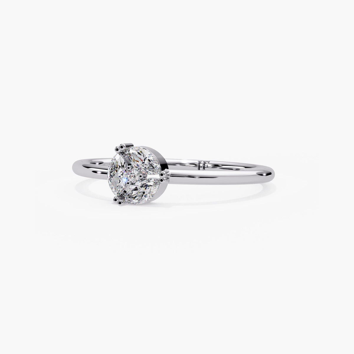 Dainty 14k white gold geometric cluster ring with prong set marquise and round lab grown diamonds.