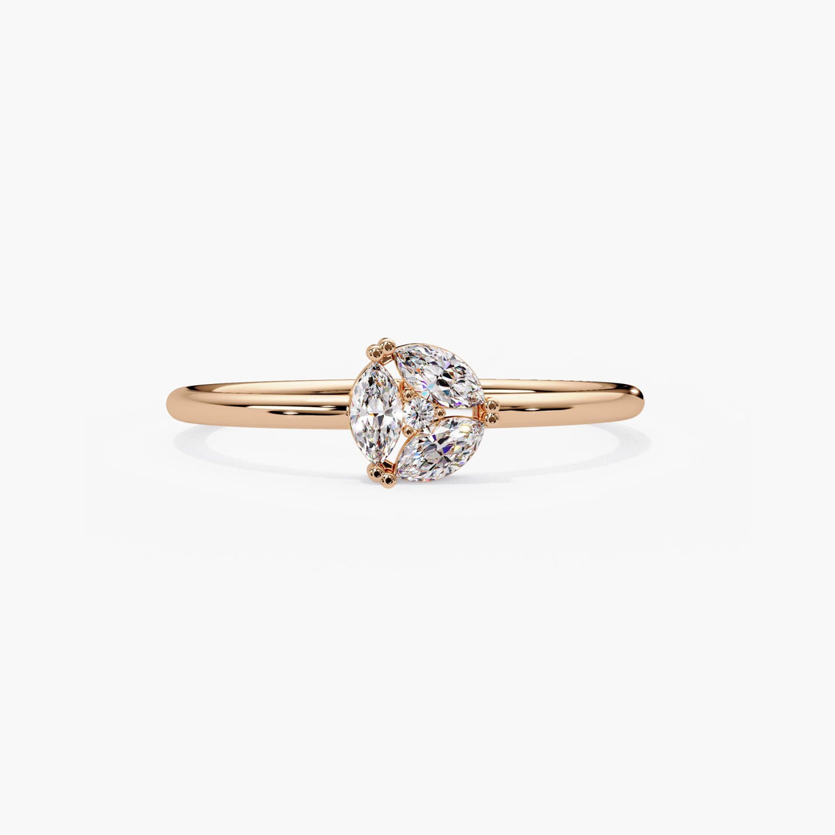 14k rose gold marquise diamond cluster ring with three marquise lab grown diamonds around a round center.
