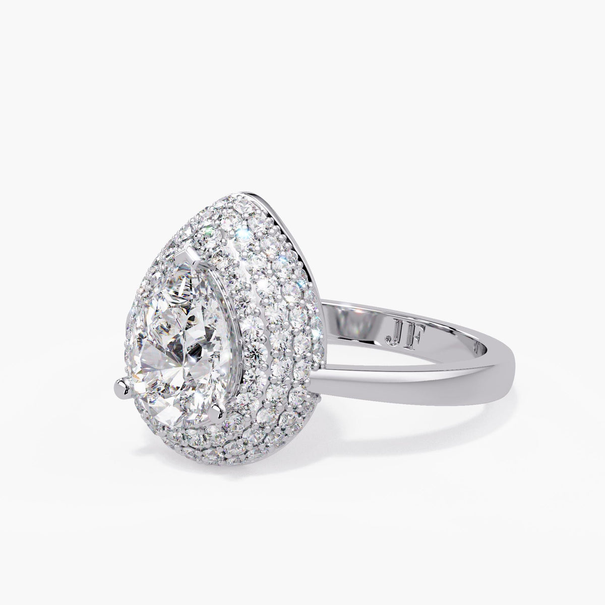 White gold pear diamond cocktail ring with a domed pavé halo, prongs holding the pear center and Jewel Frost initials inside the polished band.