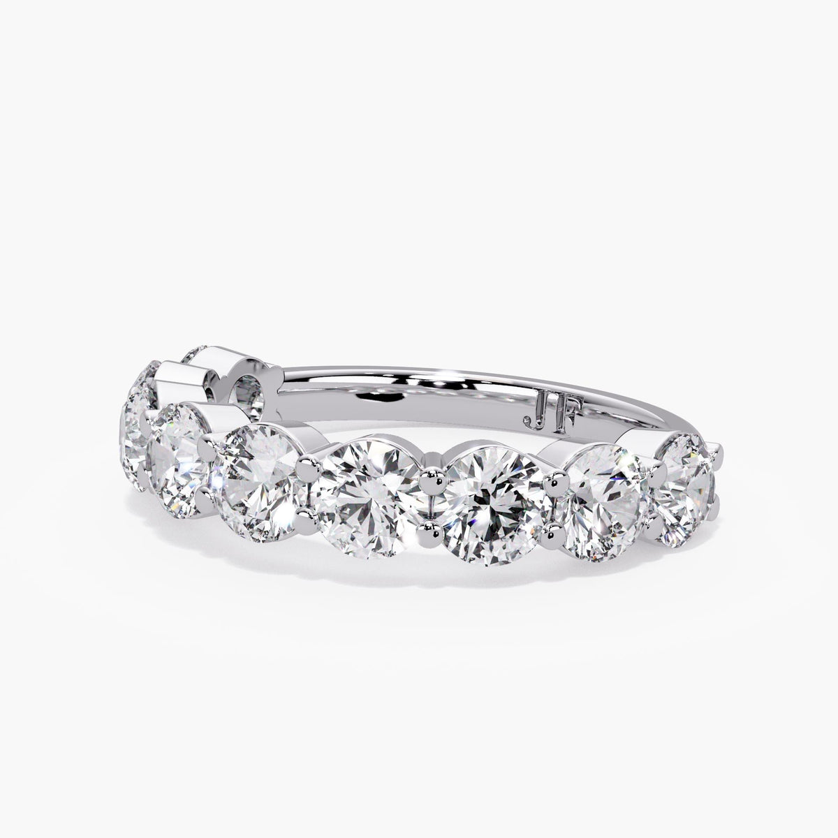 Round diamond stacking band in 14K white gold, showing the shared prong setting