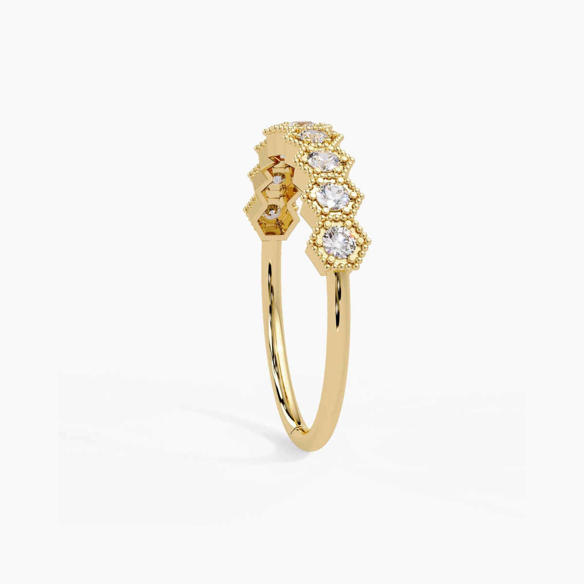 Geometric natural diamond ring with decorative milgrain frames along the diamond section and a slender yellow gold band.