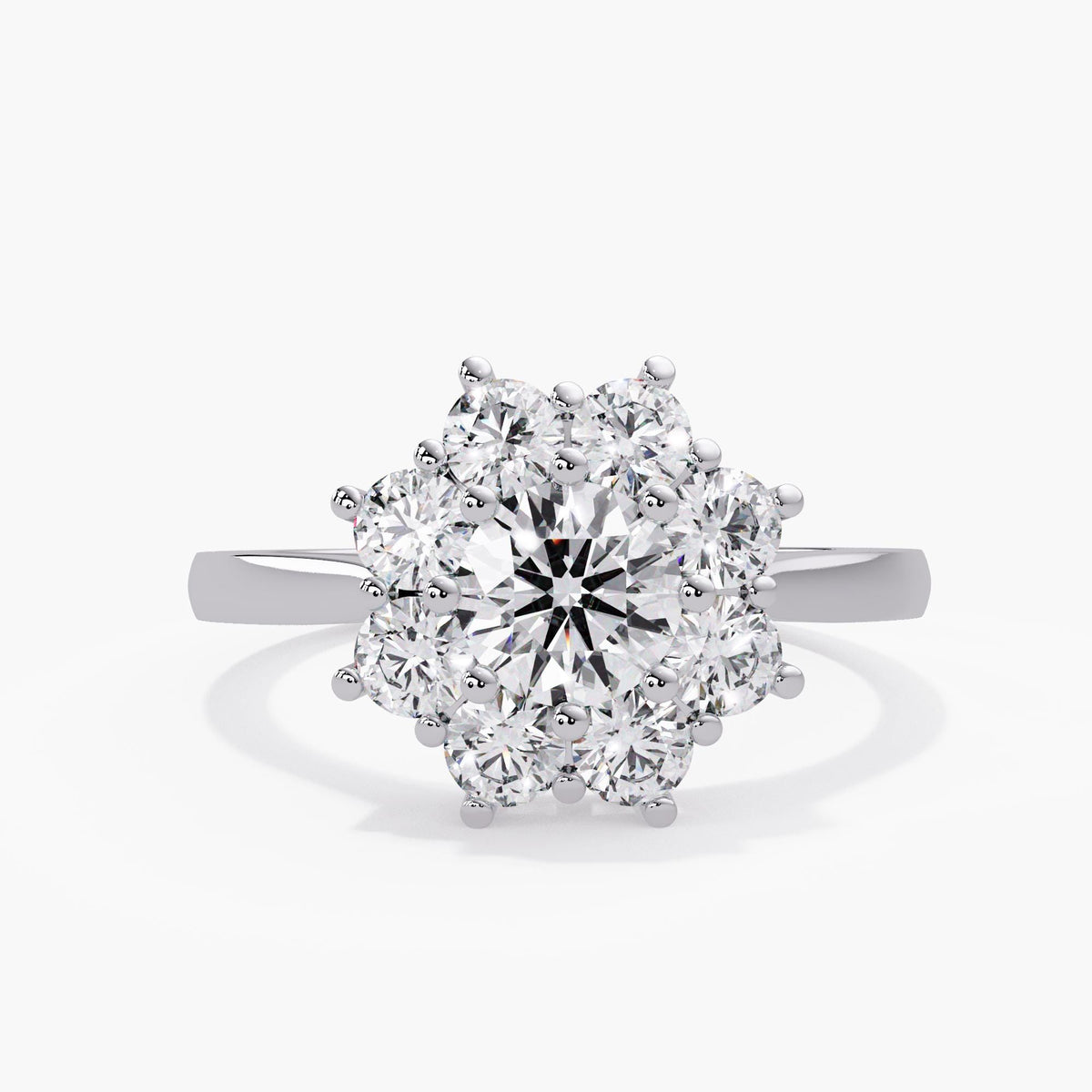 Lab created diamond floral ring in 14K white gold, with a round center, scalloped diamond halo, polished band and Jewel Frost JF mark inside the shank.
