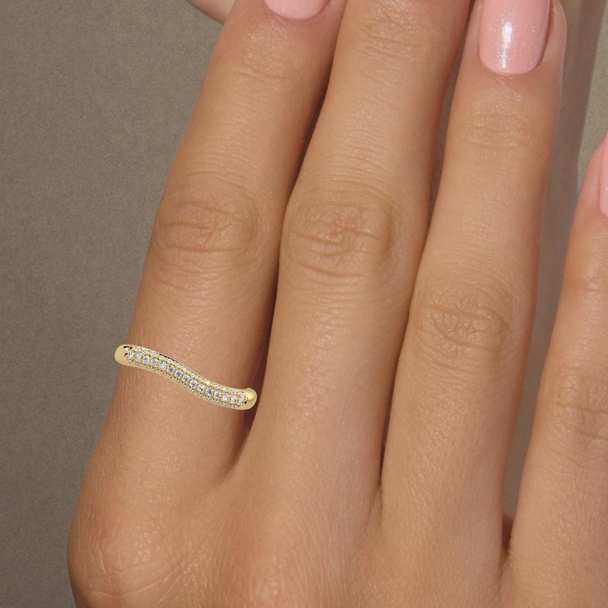 Yellow gold natural diamond wave ring viewed from above, with three rows of round brilliant diamonds following the curved front of the band.
