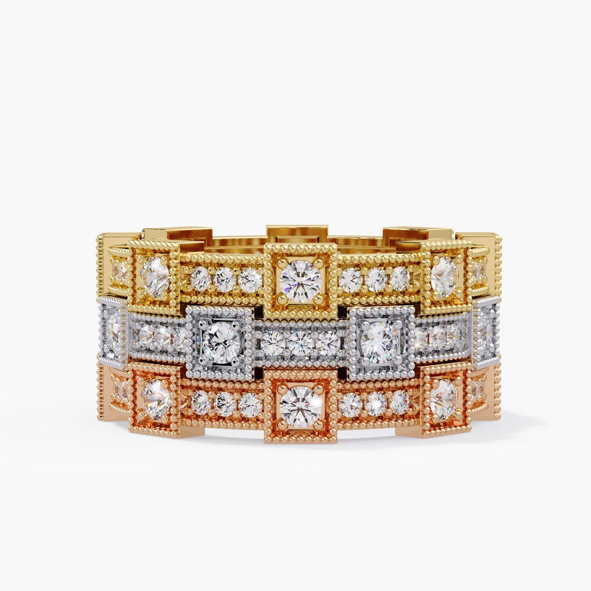 Three lab grown diamond eternity bands stacked in 14K yellow, white and rose gold, with alternating square and rectangular settings outlined by fine milgrain borders.